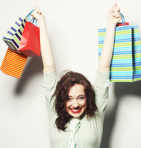 woman with colored shopping bags - Photo, Image