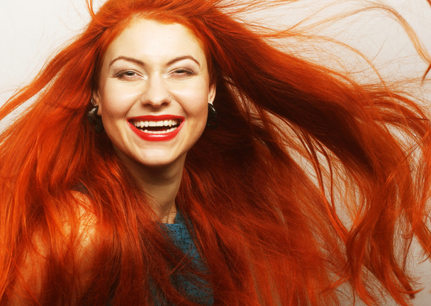 woman with long flowing red hair - Fotoğraf, Görsel