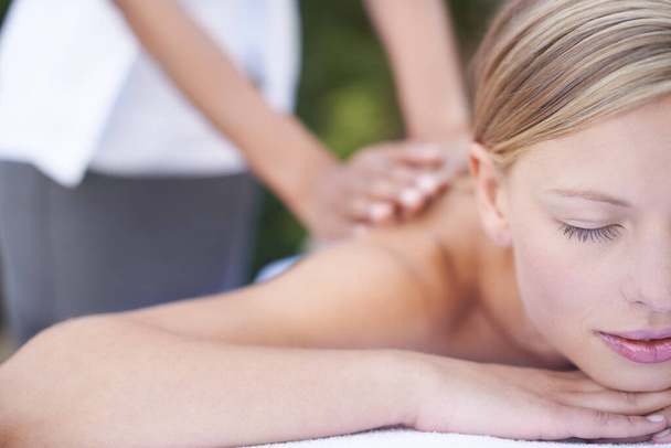 Woman, masseuse and therapist to relax, back and spa for treatment and stress relief therapy. Sleeping, massage and wellness in resort, peaceful and hands for luxury, body care and tranquility. - Valokuva, kuva