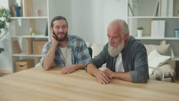 Family conversation: young and elderly men talk about life, psychological support for each other, cross-generational dialogue, heartfelt consolation, advice and wisdom, warm communication - Footage, Video