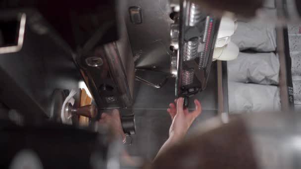 Barista frothing milk in a coffee machine. Latte coffee concept. Vertical video - Footage, Video