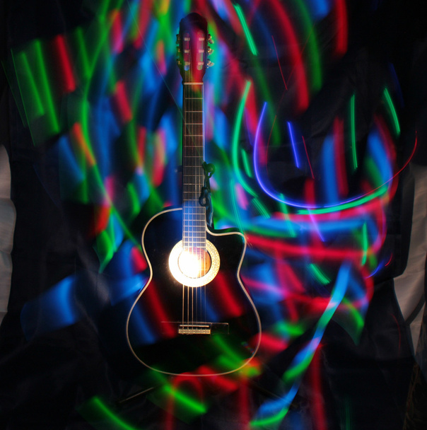 Acoustic guitar under high exposure light . - Photo, Image