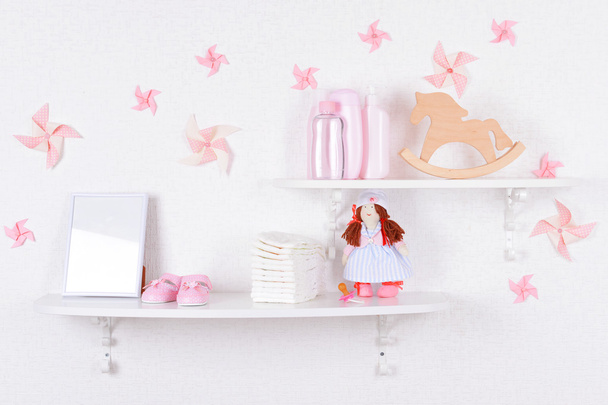 Baby accessories on shelves close-up - Fotó, kép