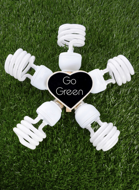 Earth Day, April 22, concept with energy saving light bulbs. - Photo, Image