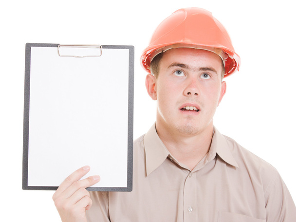 Businessman in helmet holding a tablet. - Photo, Image