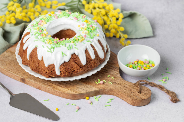 Easter Bundt Cake with Easter Eggs. Homemade vanilla bundt cake. - Photo, Image