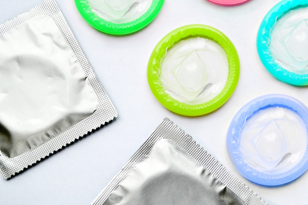 Colorful condoms isolated on white - Photo, Image