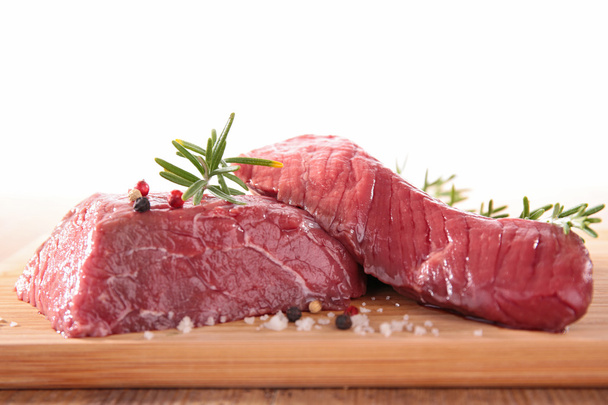 Raw meat on wooden board - Photo, Image