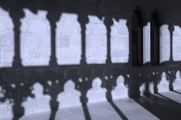 Romanesque arcade with columns and shadows in Olite. Navarra, Sp - Photo, Image