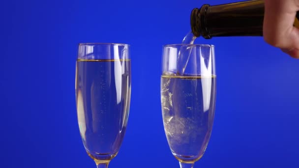 Champagne glasses on a blue background - Footage, Video