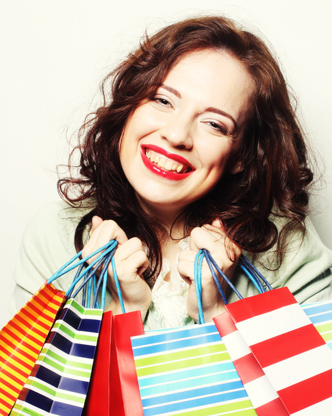 woman with colored shopping bags - Foto, imagen