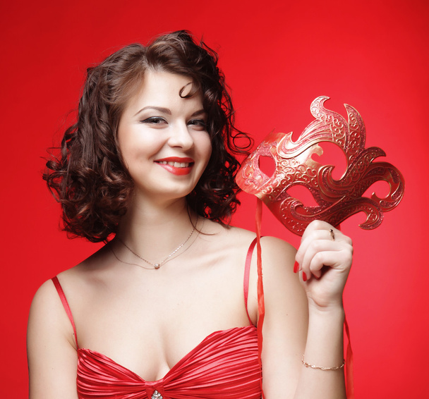 young woman with a red mysterious mask - Photo, Image