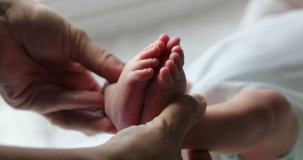 Beautiful newborn baby infant foot and feet together - Fotó, kép