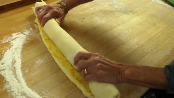Woman making orange rolls - Кадры, видео