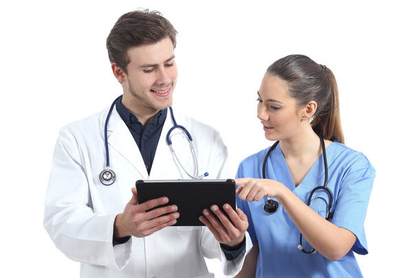 Médico e enfermeiro estudante trabalhando com um tablet
 - Foto, Imagem