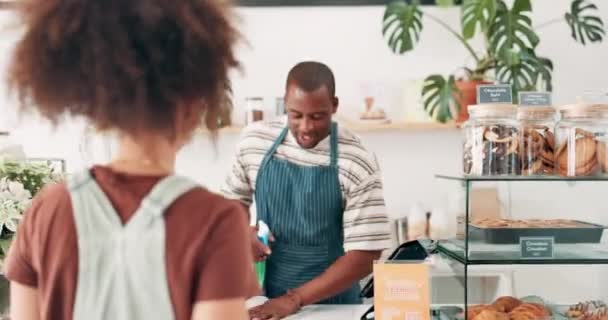 Cashier, customer service and order at counter with cafe questions, menu choice and hospitality in small business. Happy African barista, people or waiter working, talking and helping at coffee shop. - Filmagem, Vídeo