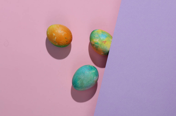 Colored easter eggs on pastel background. Creative easter layout - Photo, Image