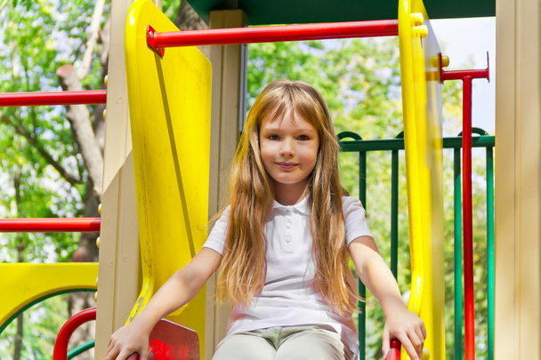 Active girl on nursery platform in summer - Valokuva, kuva