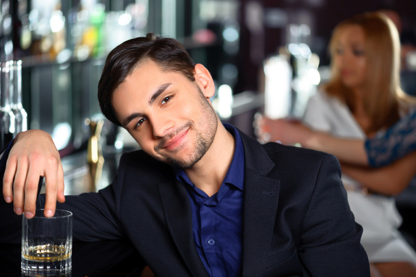 Young man in the bar - Φωτογραφία, εικόνα