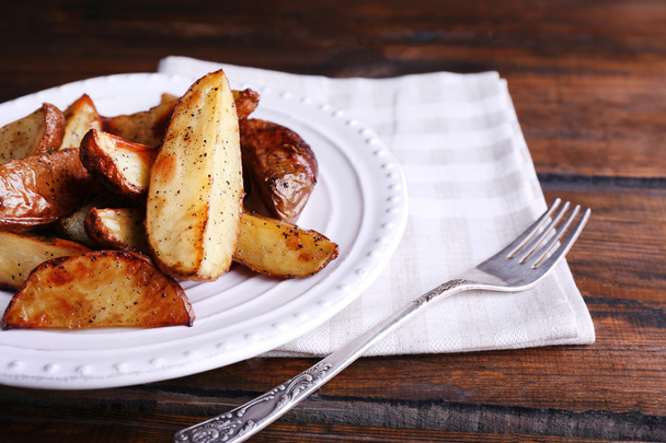 Baked potatoes on pate on wooden table - Fotografie, Obrázek