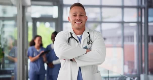 Doctor, man and arms crossed for healthcare on face, consultation service and medical professional. Happy male person, confidence and stethoscope for medicare in portrait, hospital and insurance. - Footage, Video