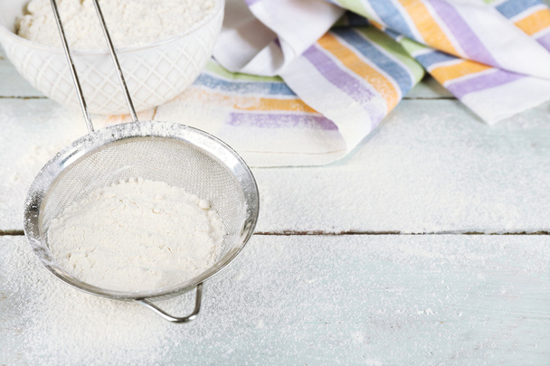 Sifting flour through sieve - Φωτογραφία, εικόνα