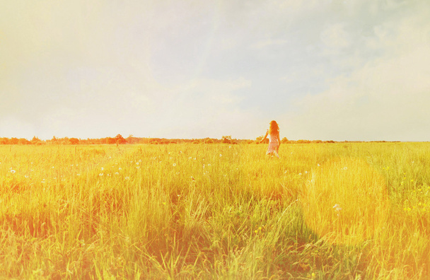 Little girl running on summer meadow - Foto, Bild