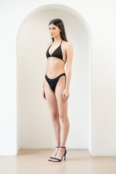 young woman model snapshot lingerie posing on white background - Valokuva, kuva