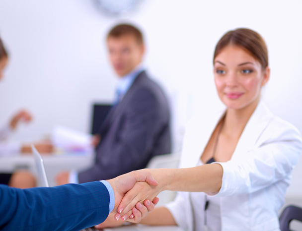 Business people shaking hands, finishing up a meeting, in office - Fotoğraf, Görsel