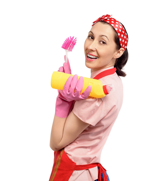 Счастливая домохозяйка с моющими средствами. - Фото, изображение