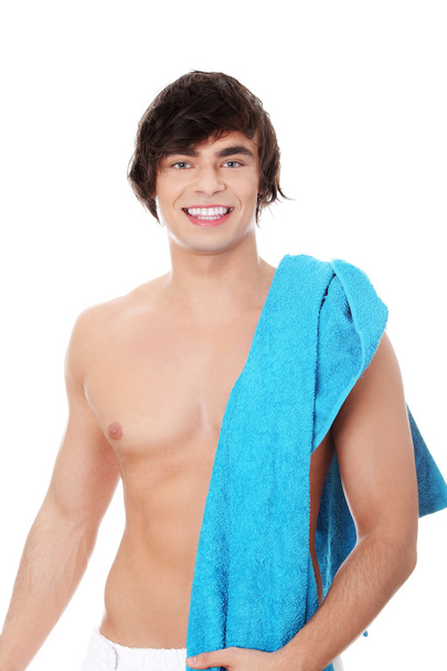 Young man with a towel. - Foto, Imagen