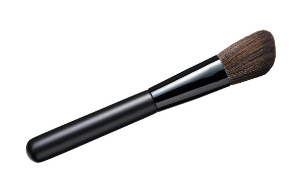 A single makeup brush placed against a white background. Viewed from above. - Photo, Image