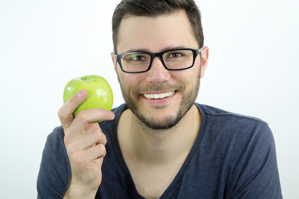 Ritratto di un uomo con in mano una mela
 - Foto, immagini