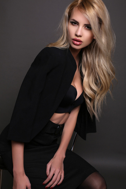 sexy beautiful woman with blond hair in elegant jacket  - Fotó, kép
