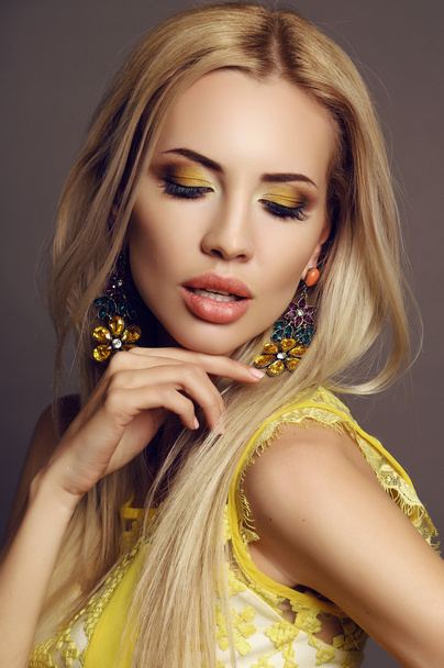 sexy woman with blond hair in elegant dress with bright makeup   - Fotó, kép