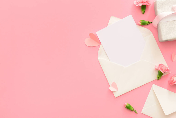 Envelopes with blank card on pink background. International Women's Day celebration - Photo, Image