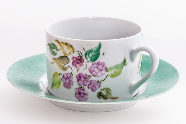 Чашка чаю з квітковим декором
 - Фото, зображення