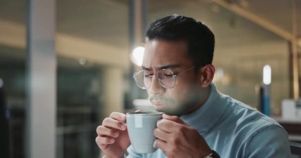 Businessman, night and glasses for planning and coffee, reading report and working overtime on startup. Asian male person, plan and research on internet, website and computer reflection for deadline. - Footage, Video
