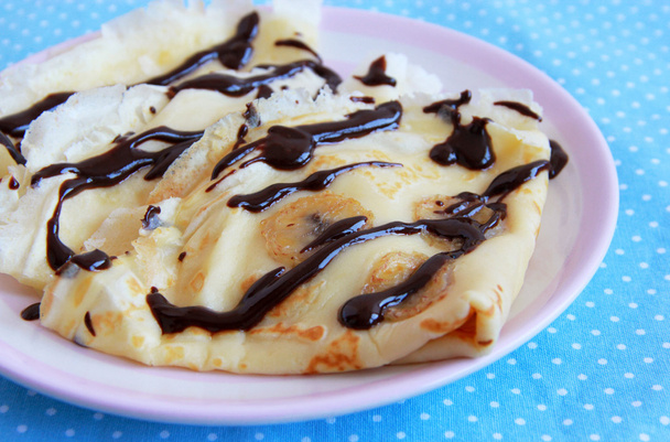 Pancakes with bananas and chocolate topping - Photo, Image