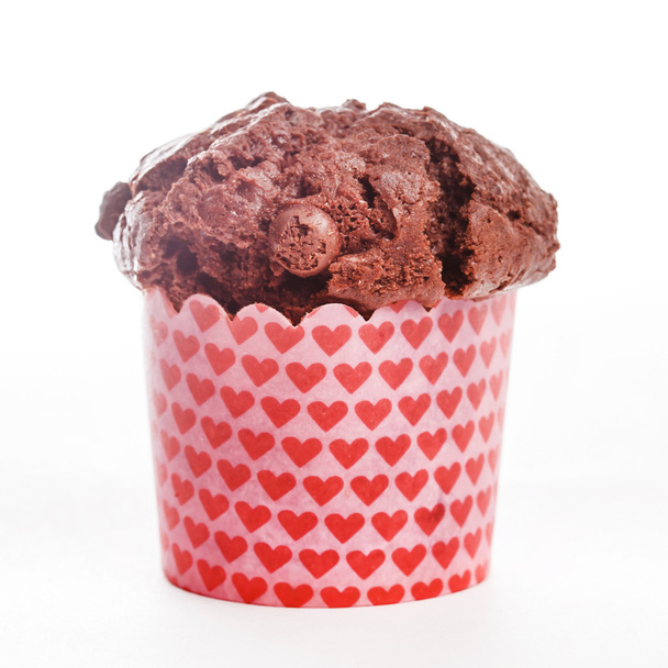 Chocolate muffin in wrapper - Φωτογραφία, εικόνα