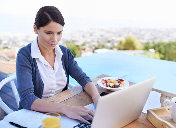 Swimming pool, business and woman with a laptop, typing and connection with entrepreneur and vacation. Person, healthy meal and employee with computer and view with research for a project and network. - Photo, Image