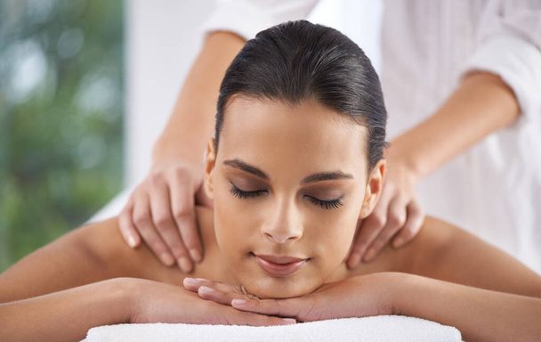 Spa, massage and wellness of a woman, luxury and weekend break with health therapy for zen treatment. Massage therapist hands for body care, relaxing and skin session of a customer feeling calm. - Photo, Image