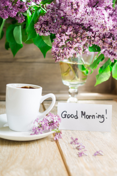 Lilac flowers and cup of coffee - Photo, image