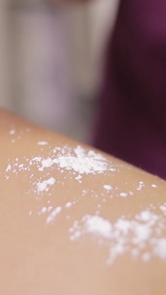 Beauty salon woman applying powder leg spa manicure. Vertical video. - Footage, Video
