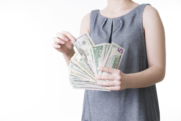 Woman with money in studio - Photo, Image