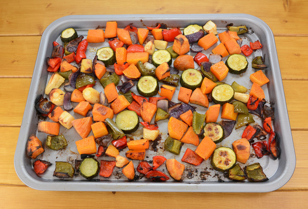 Roasted vegetables on a baking tray - Фото, изображение
