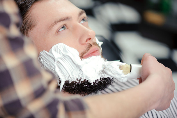 Client shaving at barber shop - Фото, зображення