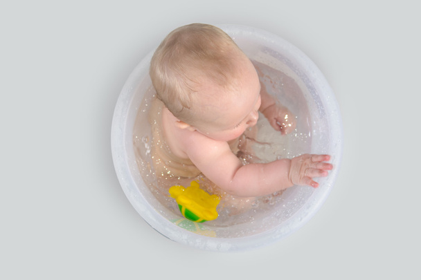 Cute Baby Having A Bath In Transparent Bucket And Playing With Toys - Photo, Image