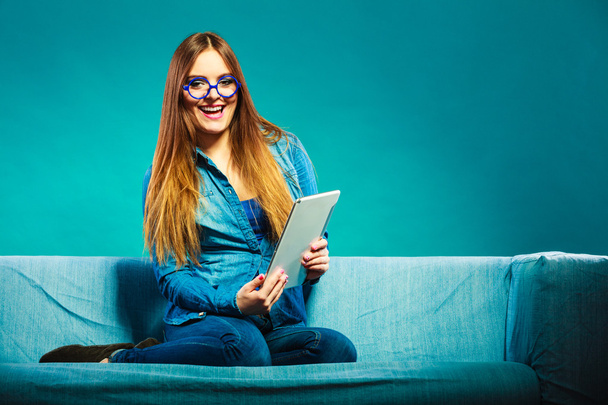 Woman in glasses using tablet - Fotó, kép