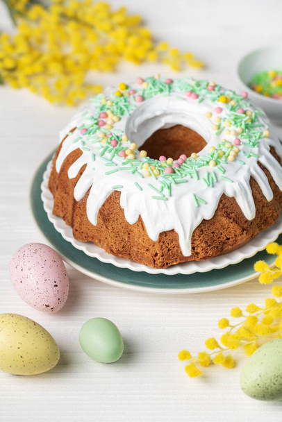 Easter Bundt Cake with Easter Eggs. Homemade vanilla bundt cake. Flat lay.  - Photo, Image